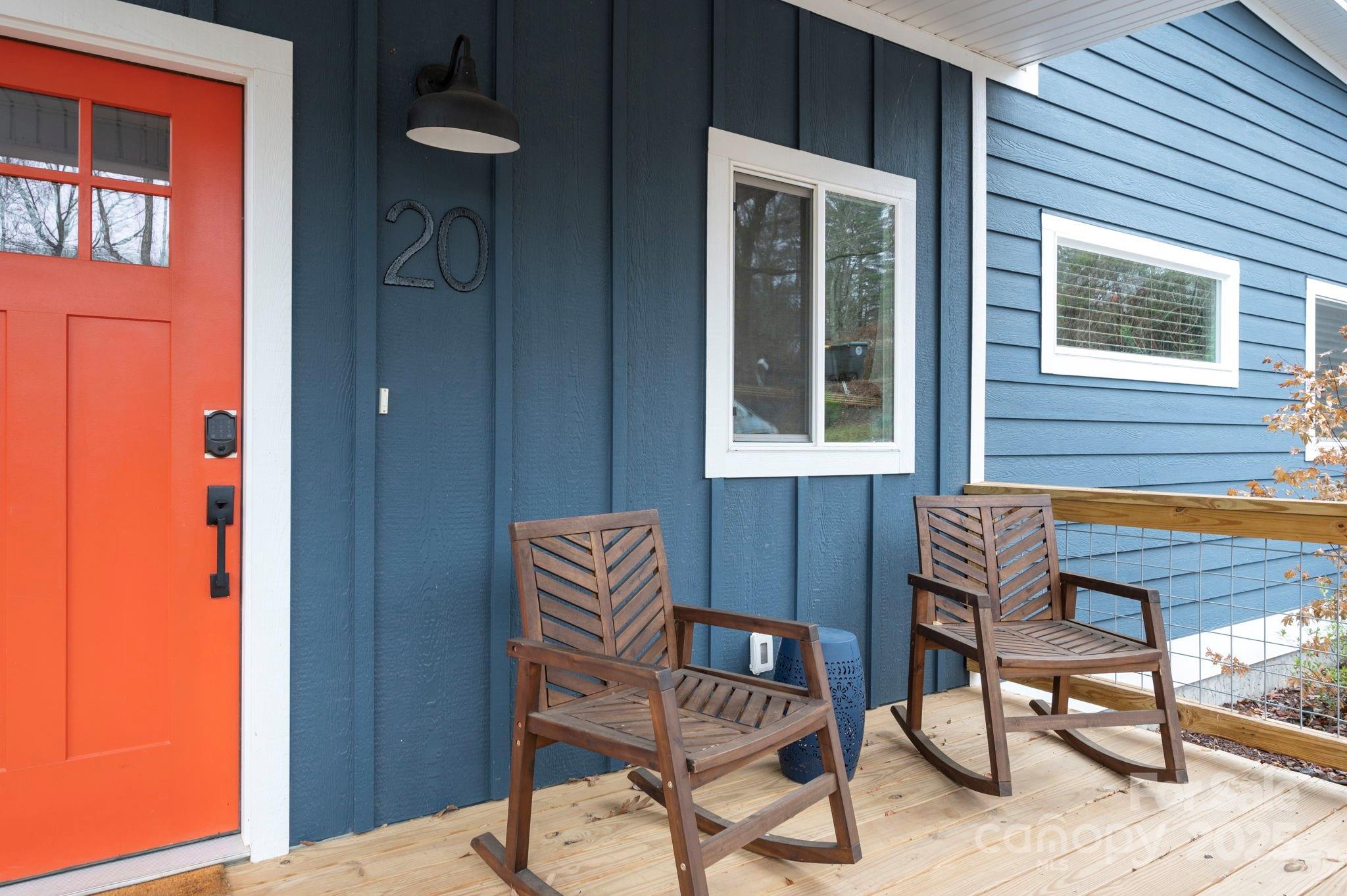 20 Garden Road Asheville, NC 28804 - Photo 27 of 44 a wooden bench sitting in front of a building