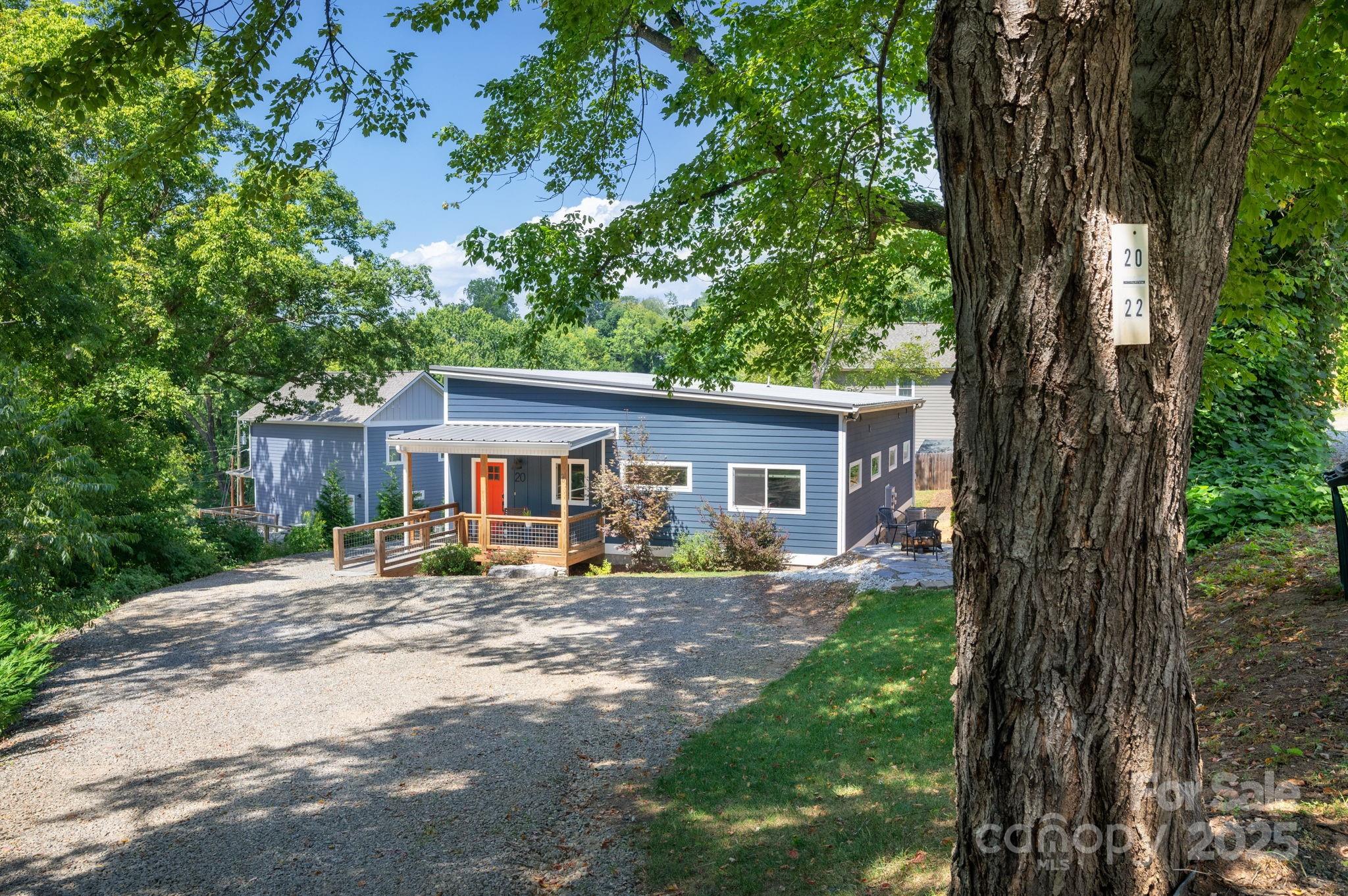 20 Garden Road Asheville, NC 28804 - Photo 3 of 44 a view of a house with a backyard and chairs