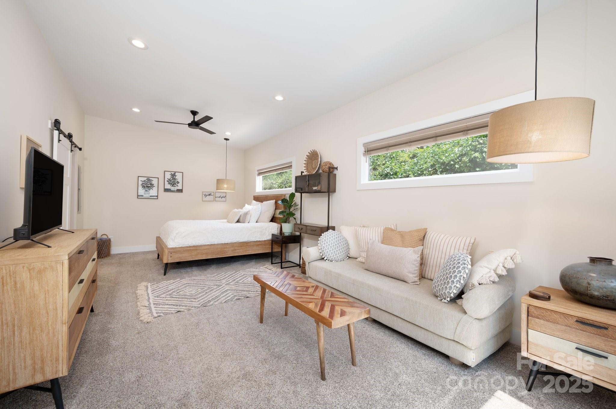 20 Garden Road Asheville, NC 28804 - Photo 35 of 44 a living room with furniture and a flat screen tv