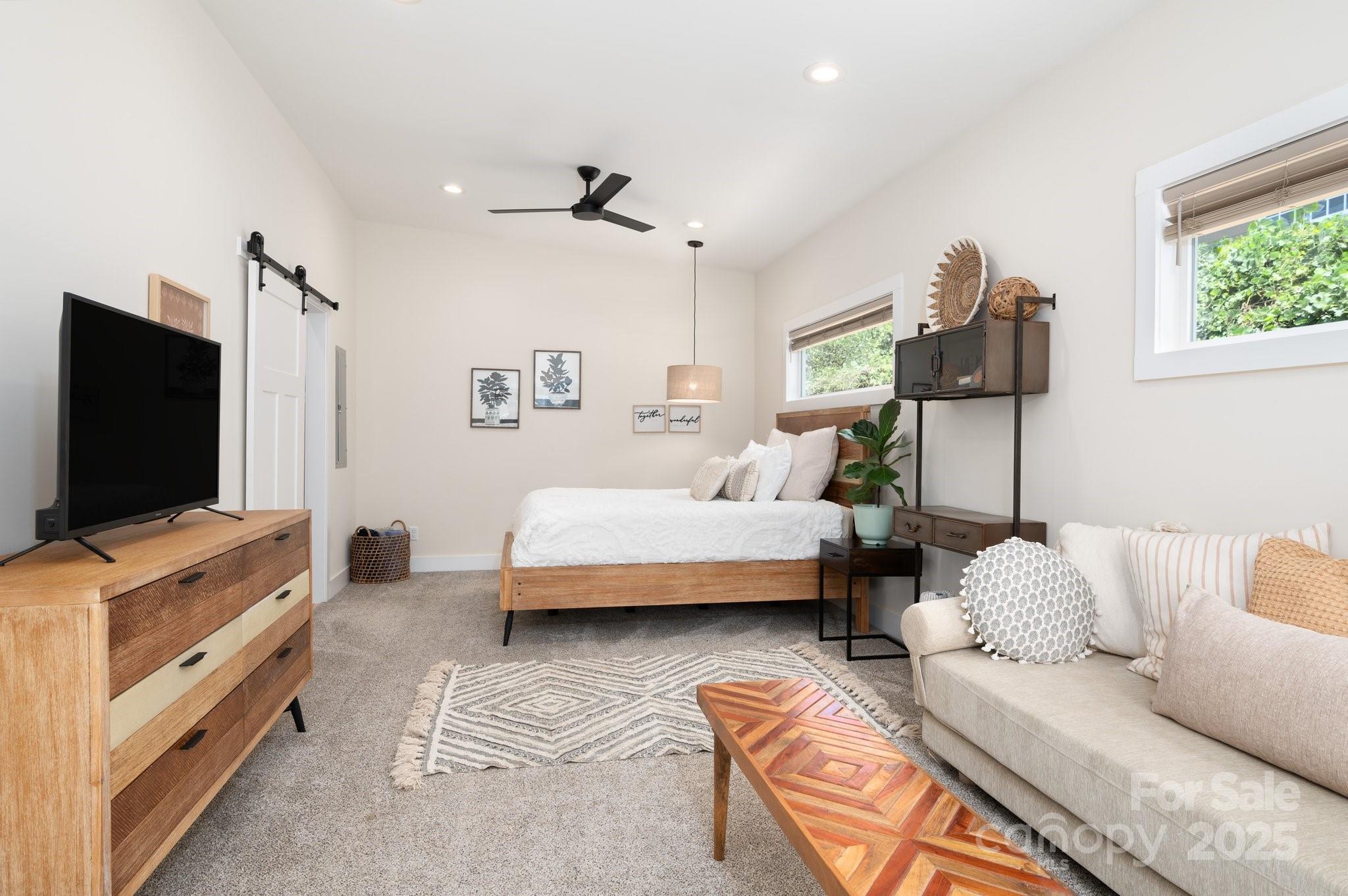 20 Garden Road Asheville, NC 28804 - Photo 36 of 44 a bedroom with furniture and a flat screen tv