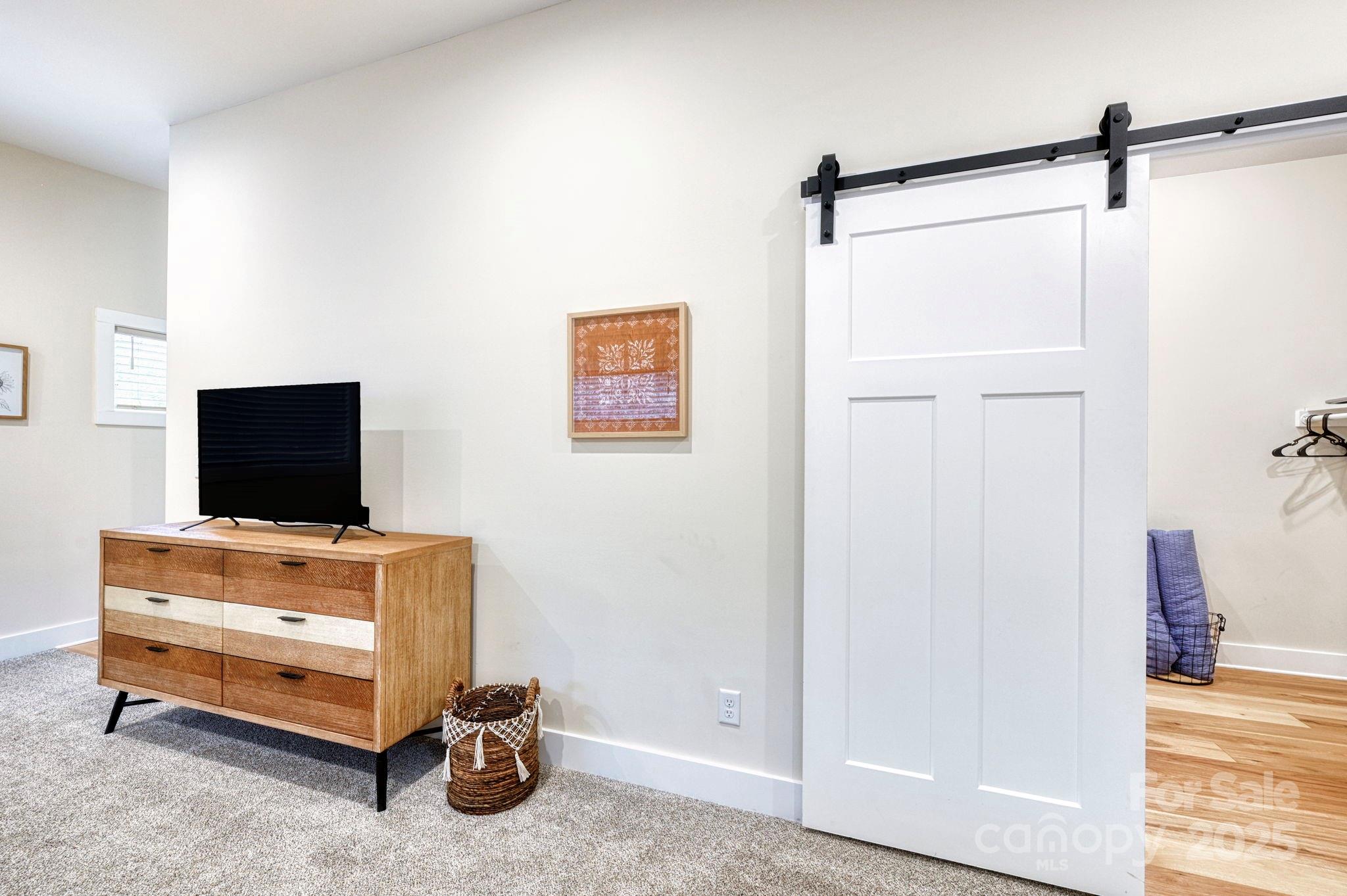 20 Garden Road Asheville, NC 28804 - Photo 39 of 44 a room with furniture and a flat screen tv