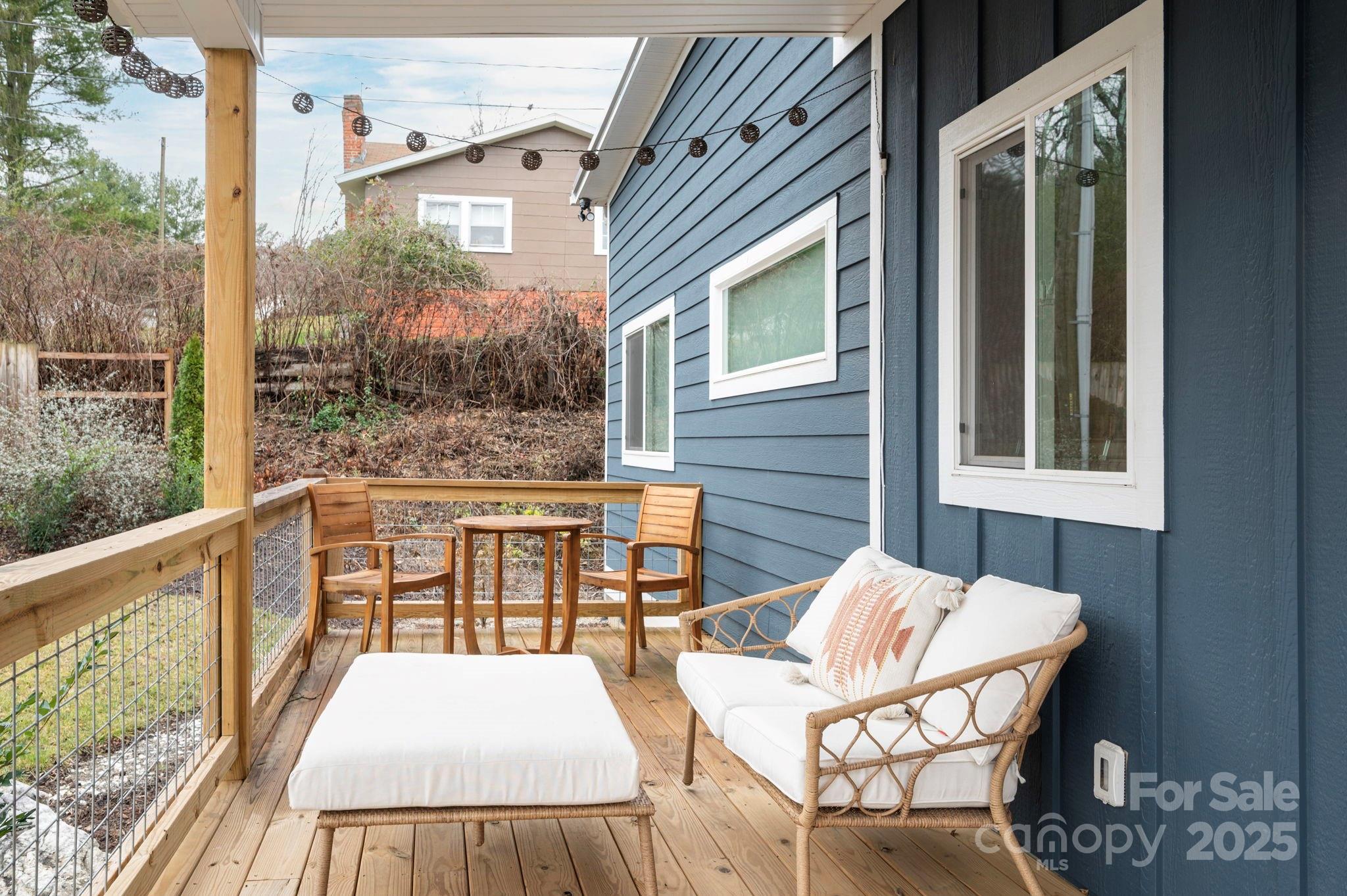20 Garden Road Asheville, NC 28804 - Photo 6 of 44 a view of a patio with table and chairs and wooden floor