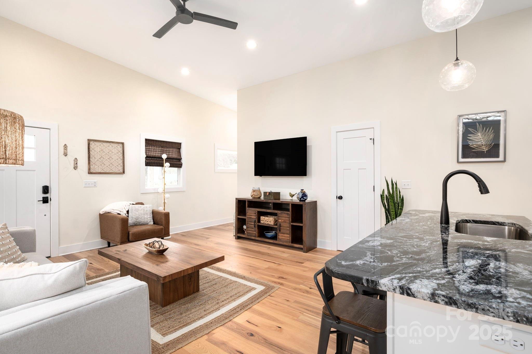 20 Garden Road Asheville, NC 28804 - Photo 10 of 44 a living room with furniture and a flat screen tv