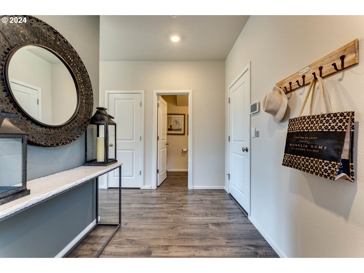 2682 V Street Springfield, OR 97477 - Photo 4 of 21 a view of a hallway with wooden floor a washer and dryer