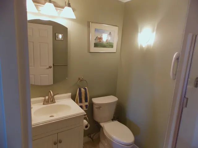 a bathroom with a toilet a sink and shower