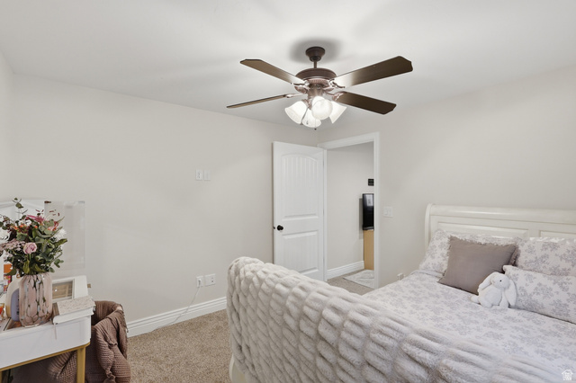 10676 Urban Rdg Cove South Jordan, UT 84095 - Photo 19 of 48 Neutral-toned interior with soft carpet flooring and white baseboards