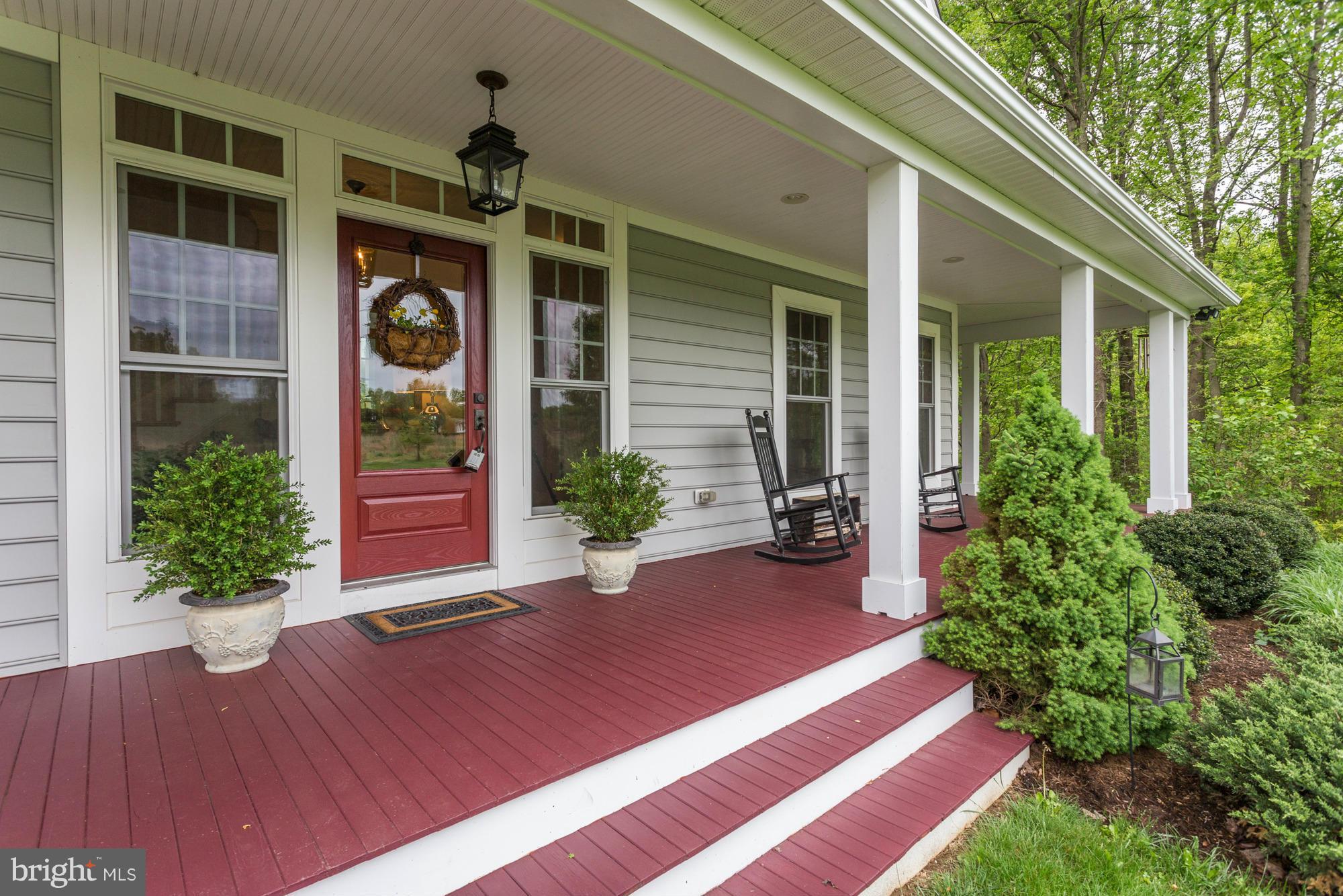 4835 South Polling House Road Lothian, MD 20711 - Photo 2 of 29 Mahogany Front Porch for your rockers!