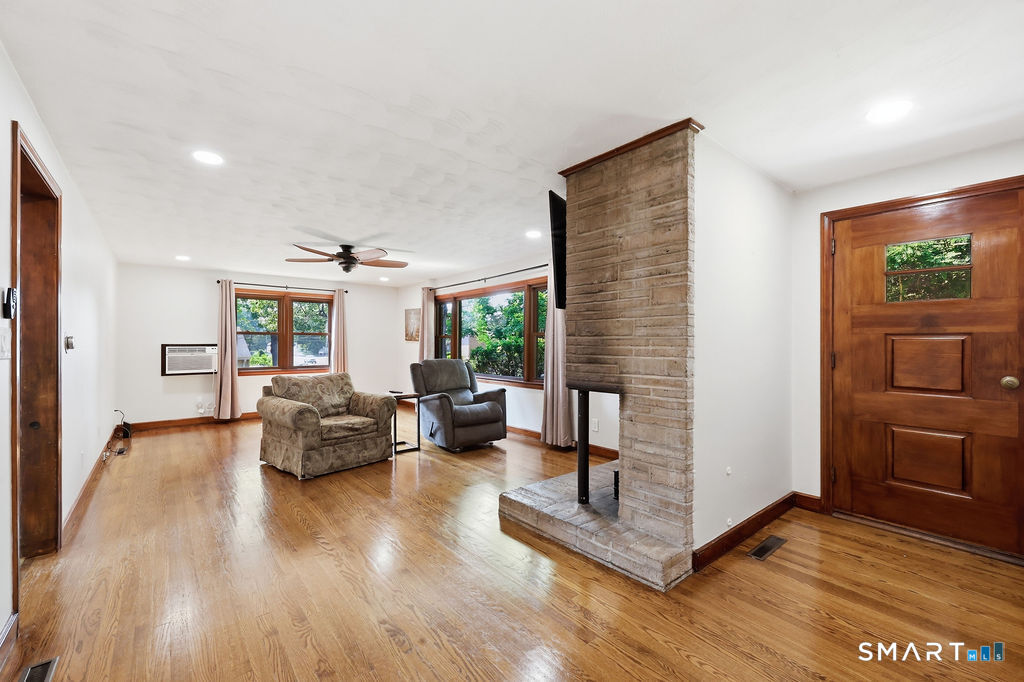 630 South Elm Street Wallingford, CT 06492 - Photo 14 of 30 a living room with furniture and wooden floor