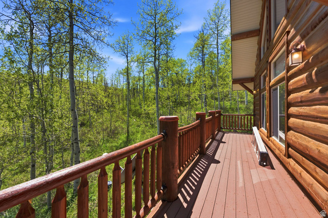 2096 South Aspen Ridge Coalville, UT 84017 - Photo 8 of 44 Expansive log-sided exterior with a natural wood deck