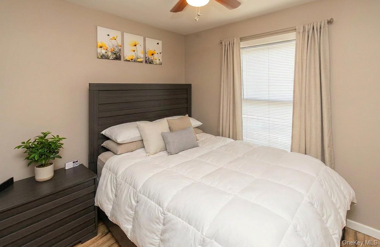 29 Murray Road Middletown, NY 10940 - Photo 11 of 24 a bedroom with a bed and a potted plant