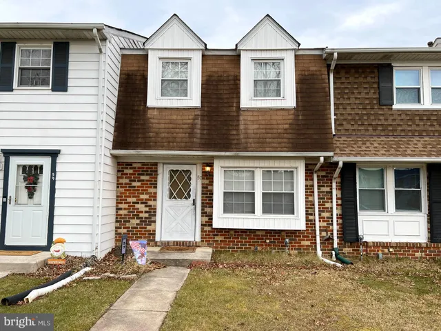 a front view of house with yard and porch