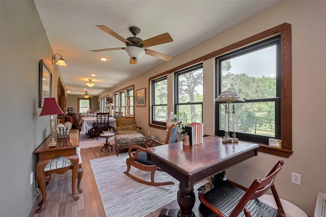 a view of a dining room with furniture window and wooden floor