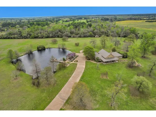 a view of a lake with a yard