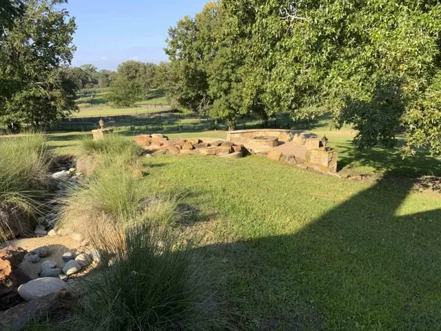a view of a lake with a yard