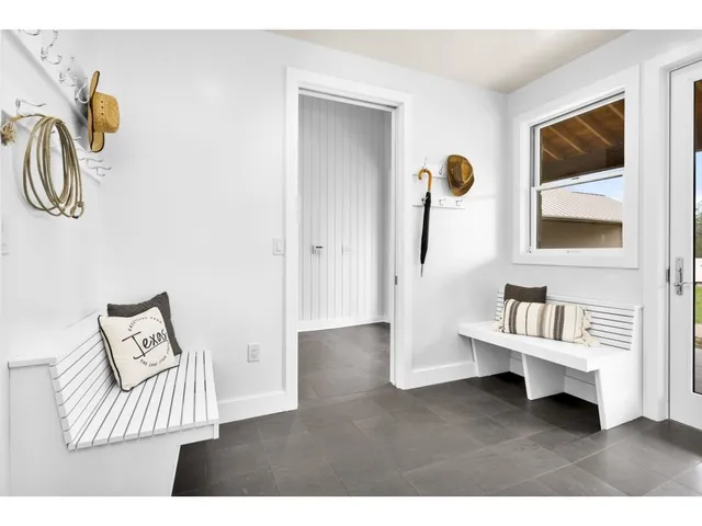 a view of a livingroom with furniture and windows