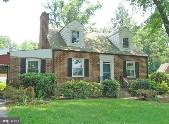 9511 Monroe Street Silver Spring, MD 20910 - Photo 22 of 22 a front view of a house with a garden