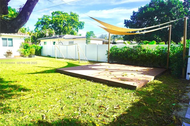 a view of yard with swimming pool