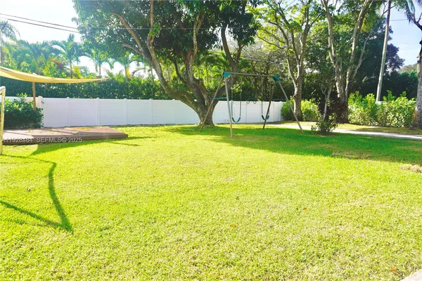 a view of pool and outdoor space