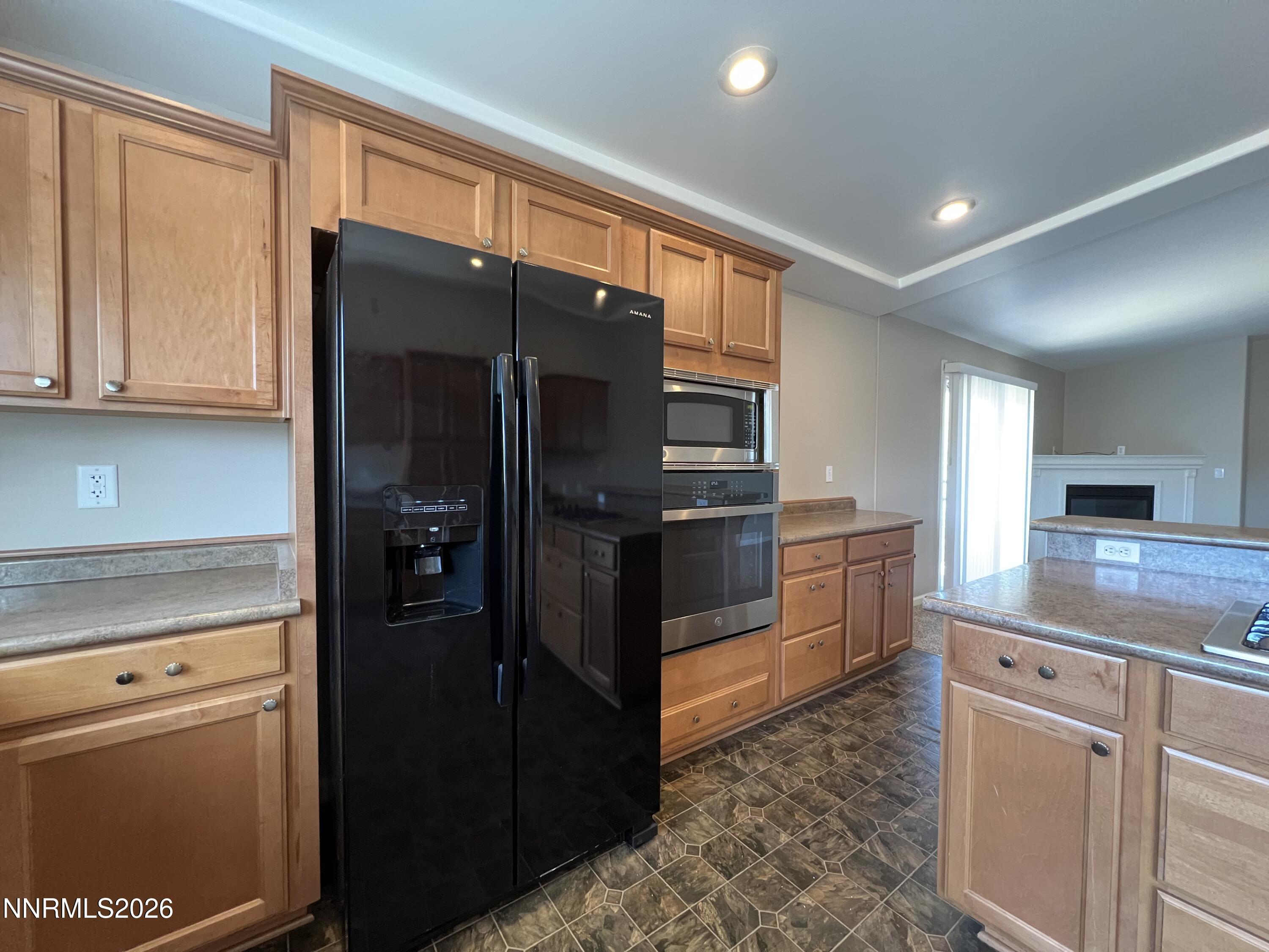 18406 Teddy Bear Court Reno, NV 89508 - Photo 10 of 44 a kitchen with stainless steel appliances granite countertop a refrigerator and a stove