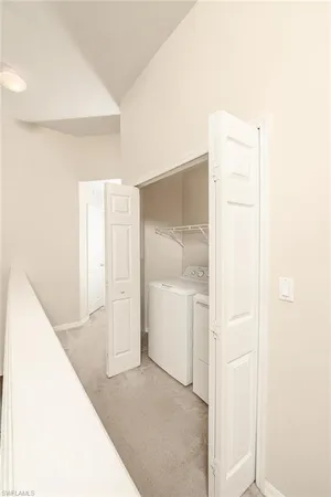 a view of a hallway with closet