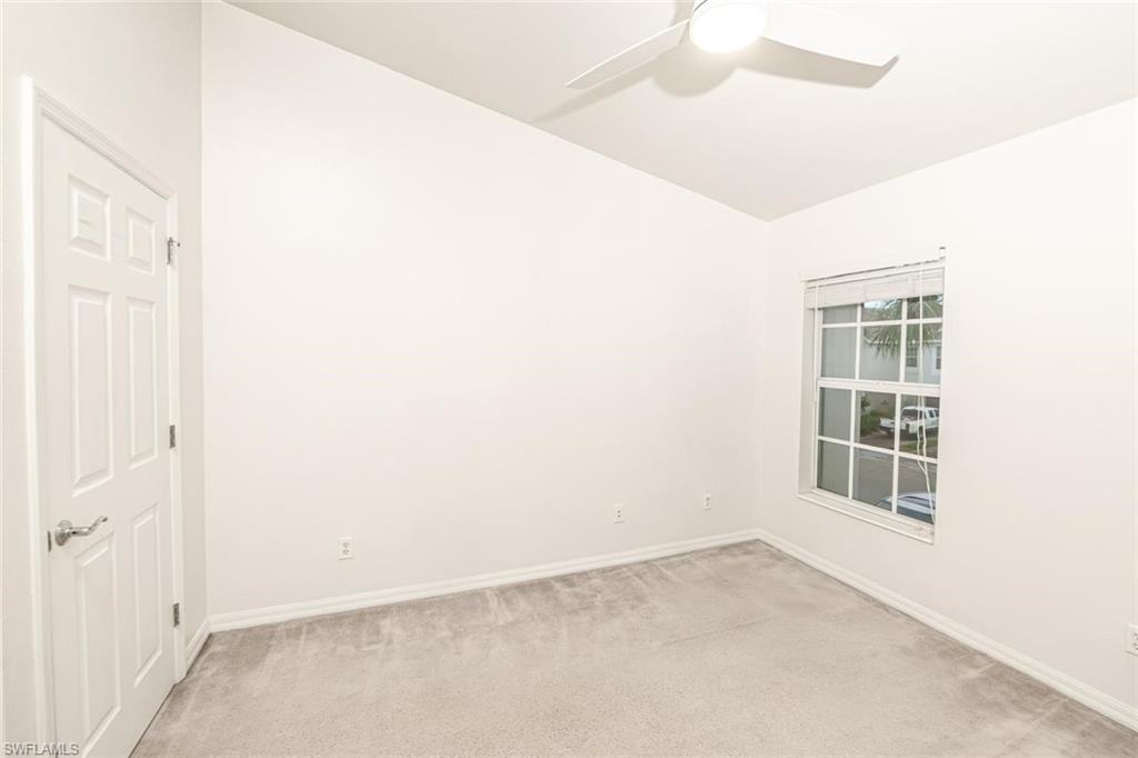 16250 Ravina Way, Unit 87 Naples, FL 34110 - Photo 6 of 15 an empty room with windows
