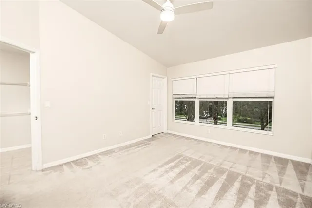 an empty room with windows and entrance