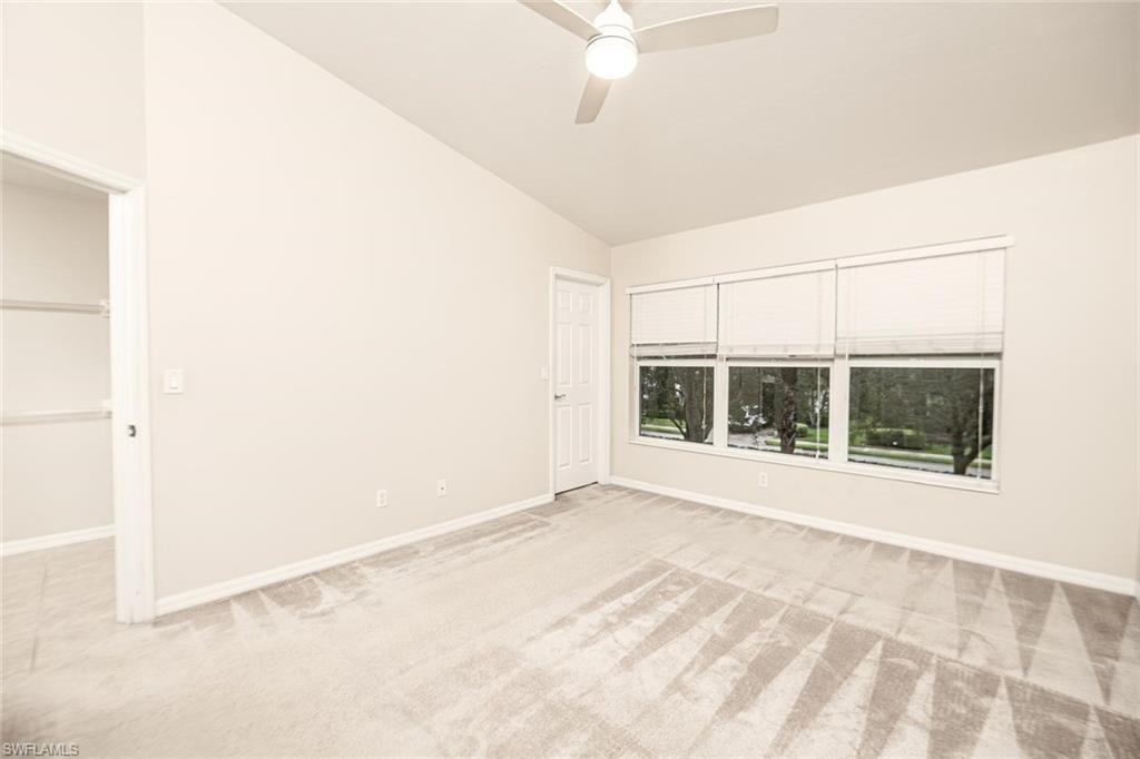 16250 Ravina Way, Unit 87 Naples, FL 34110 - Photo 8 of 15 an empty room with windows and entrance