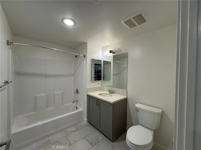 a bathroom with a toilet sink and bathtub