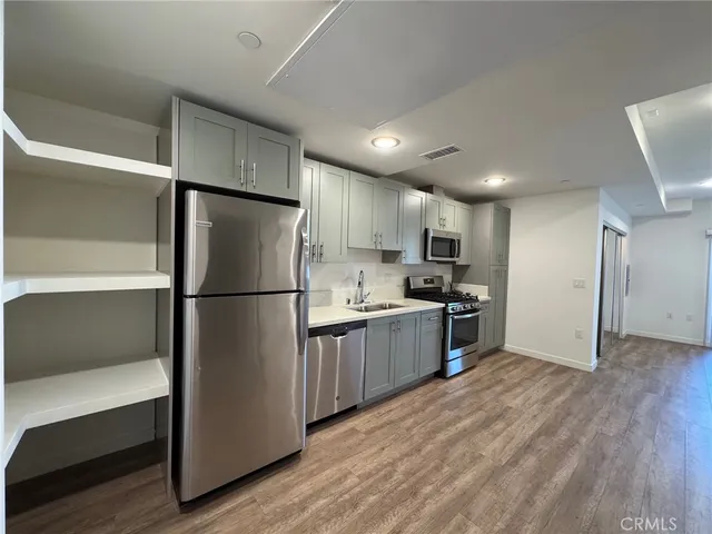 a kitchen with a refrigerator and a refrigerator
