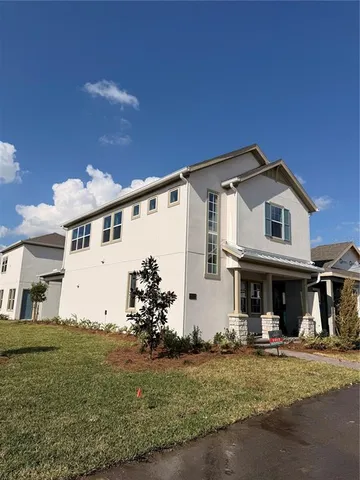 a front view of a house with yard