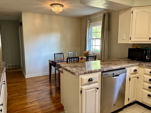 5 Boone Court Normal, IL 61761 - Photo 14 of 29 a kitchen with stainless steel appliances granite countertop a sink and a granite counter tops with wooden floors