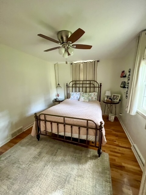 5 Boone Court Normal, IL 61761 - Photo 16 of 29 a bedroom with a bed a dresser and potted plant