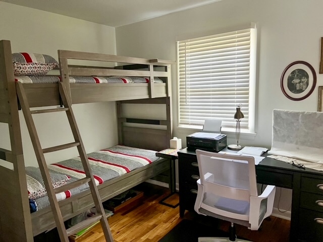 5 Boone Court Normal, IL 61761 - Photo 19 of 29 a bedroom with a bed and a chandelier