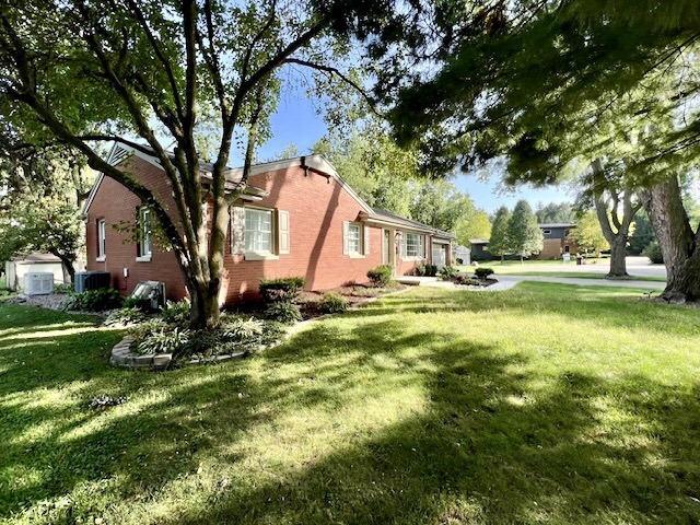 5 Boone Court Normal, IL 61761 - Photo 3 of 29 a backyard of a house with table and chairs