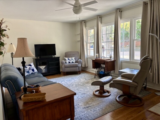 5 Boone Court Normal, IL 61761 - Photo 8 of 29 a living room with furniture a flat screen tv and a large window