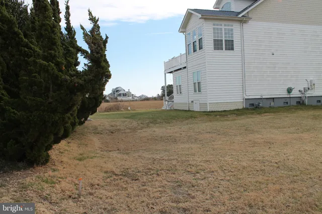 a view of a backyard of the house
