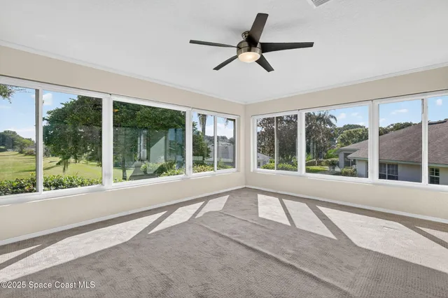 a view of an empty room with a large window
