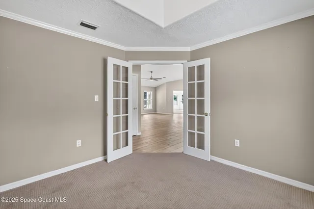 a view of an empty room with stairs