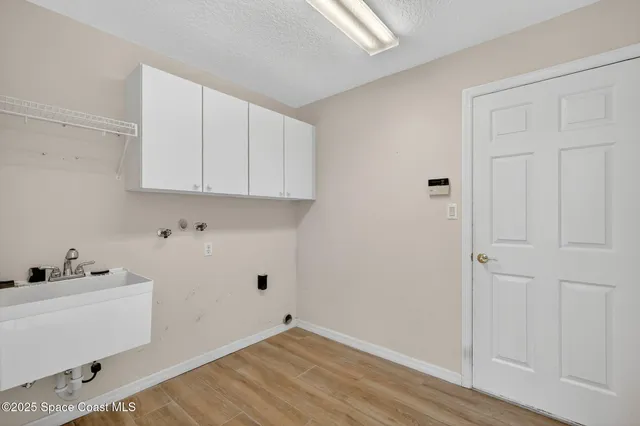 a view of cabinets and wooden floor