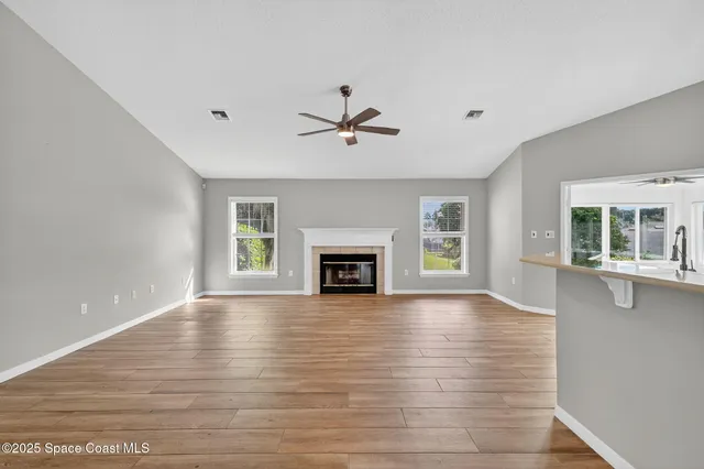 a view of a room window and fireplace
