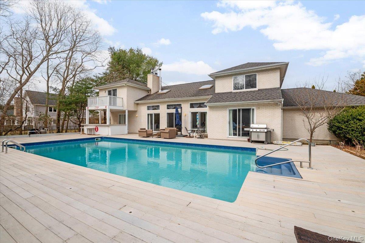 24 Wisteria Drive Remsenburg, NY 11960 - Photo 35 of 44 a view of a house with pool