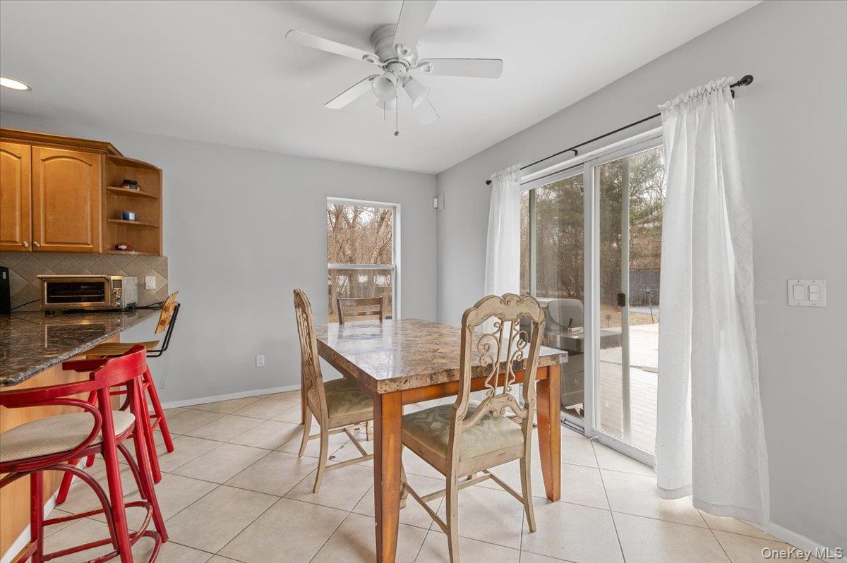 24 Wisteria Drive Remsenburg, NY 11960 - Photo 6 of 44 a dining room with furniture and window