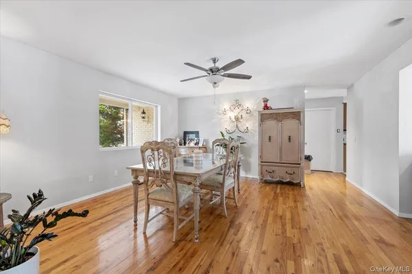 a view of a dining room with furniture and a wooden floor