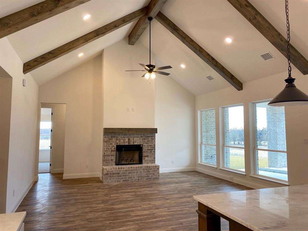 2284 Erwin Road Poolville, TX 76487 - Photo 8 of 24 Open living room with beautiful wood beams