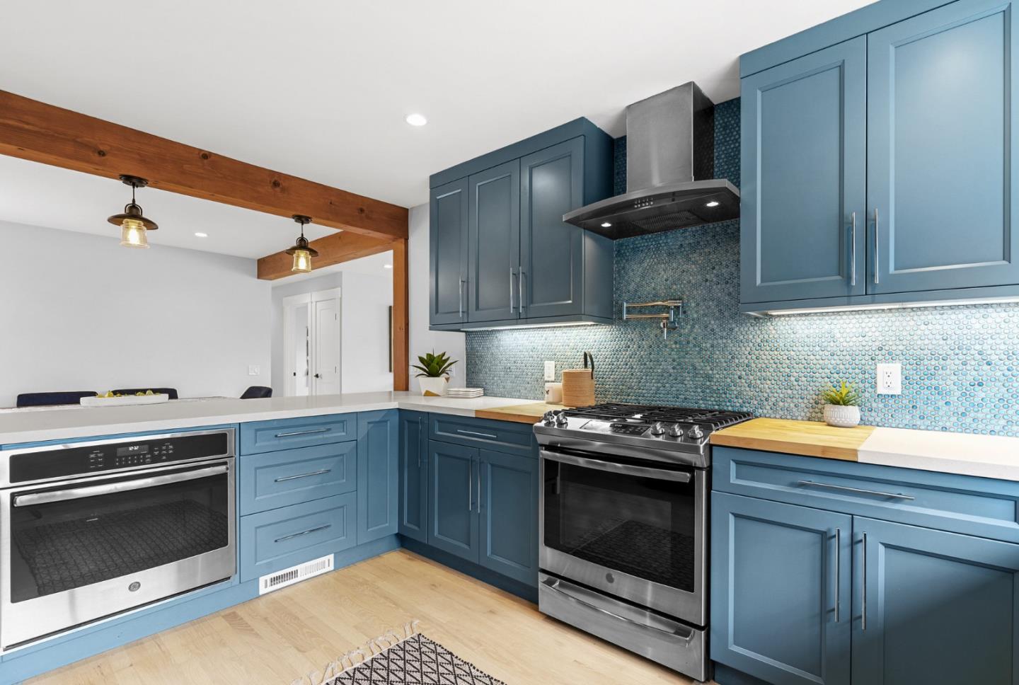 1149 Modoc Street Seaside, CA 93955 - Photo 12 of 37 a kitchen with stainless steel appliances a stove a sink and a microwave