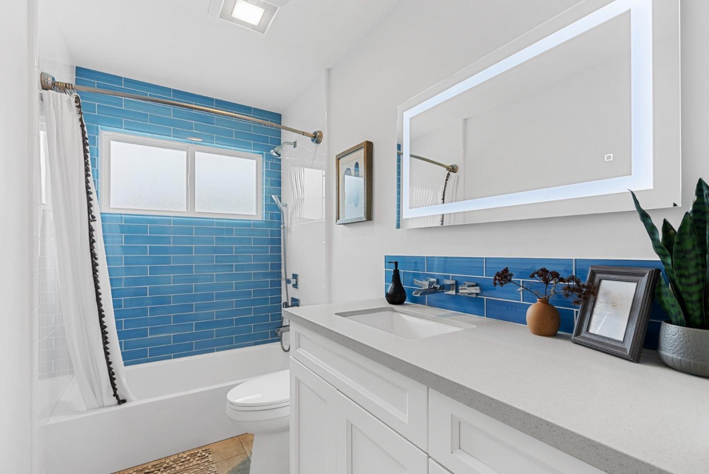 1149 Modoc Street Seaside, CA 93955 - Photo 21 of 37 a bathroom with a sink a toilet and shower