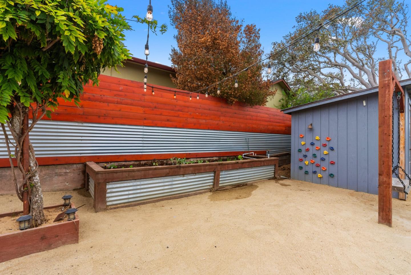 1149 Modoc Street Seaside, CA 93955 - Photo 26 of 37 a view of a backyard with stairs and a tree