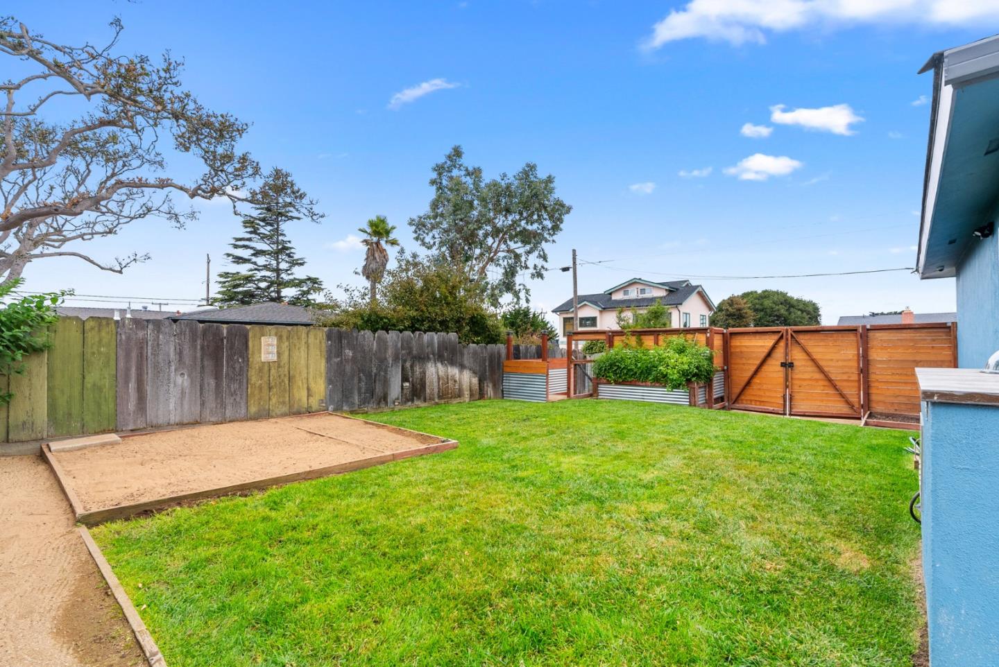 1149 Modoc Street Seaside, CA 93955 - Photo 28 of 37 a view of a backyard with a garden
