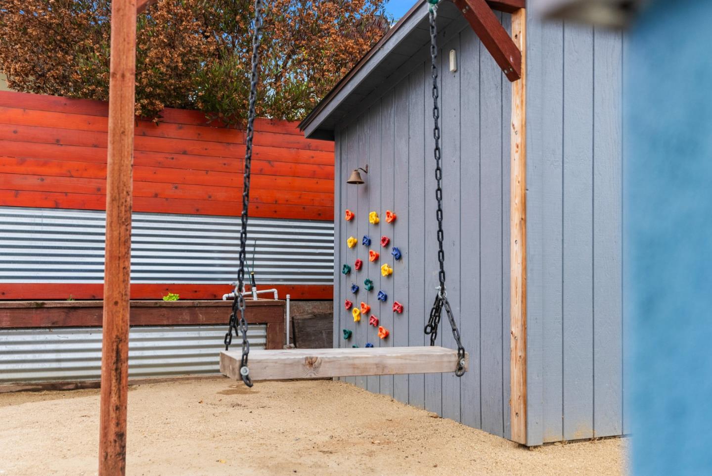 1149 Modoc Street Seaside, CA 93955 - Photo 34 of 37 a backyard of a house with wooden fence and large trees