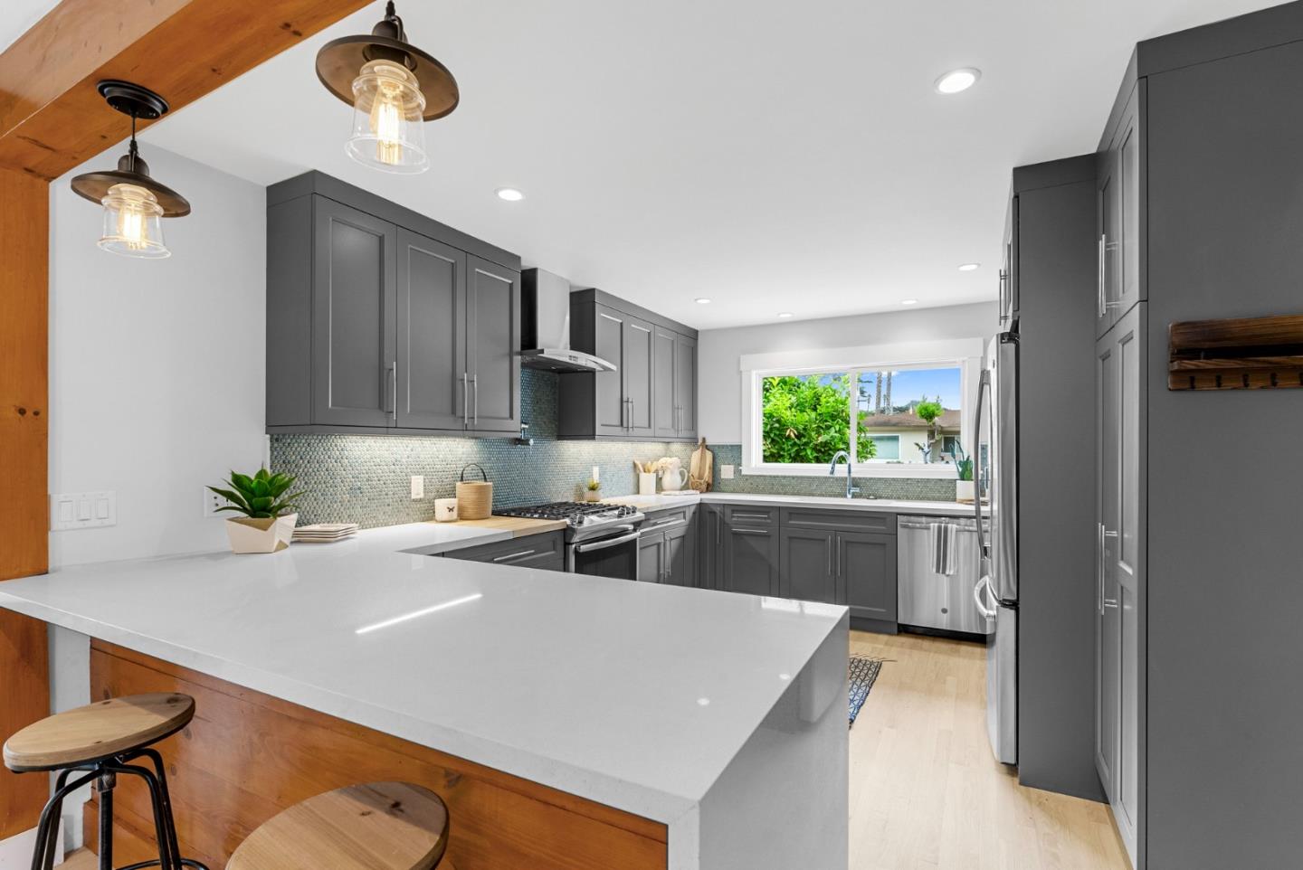1149 Modoc Street Seaside, CA 93955 - Photo 10 of 37 a kitchen with a table chairs refrigerator and microwave